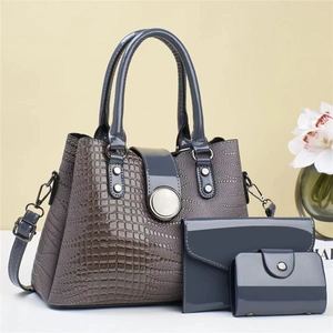 Three-piece grey lizard pattern tote bag set with handbag, clutch and card holder
