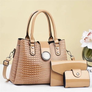 Beige 3-piece lizard pattern handbag set including tote, crossbody bag, and wallet