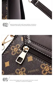 Close-up of golden metal hooks and smooth zipper hardware on a printed leather bag