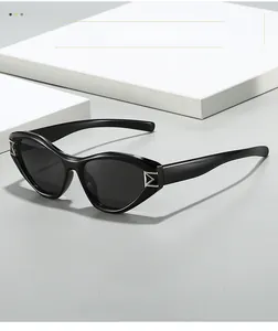 Detail of black frame sunglasses with silver M-shaped metal hardware on the temple