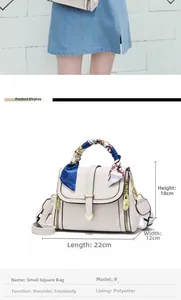 White crossbody bag with embossed texture, silk scarf handle, and letter print strap