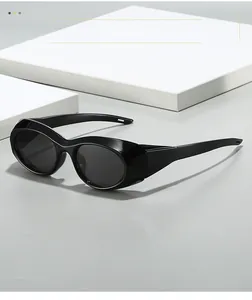 Detail of futuristic black oval sunglasses with wide windproof temples and sleek finish