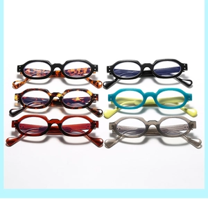 Selection of six retro small oval eyeglass frames in various colors with metallic rivets
