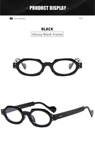 Detail view of bright black oval eyeglasses with retro thick frames and metal rivets