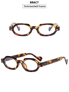 Close-up of retro tortoiseshell oval frame sunglasses with wide temples on white background