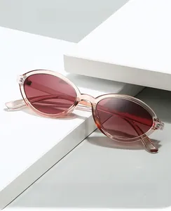 Macro view of transparent pink oval frames with dark lenses for fashion eye protection