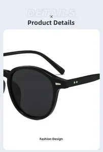 Close-up of retro black round frame sunglasses featuring silver rivet temple details