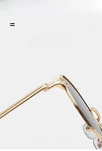 Detail of high-elasticity metal hinge and gold alloy frame for lightweight sunglasses