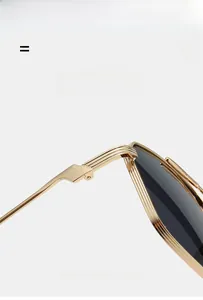 Macro detail of high-elastic gold metal frame hinges on lightweight sunglasses
