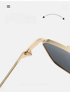 Macro shot of durable metal hinges on gold aviator sunglasses with textured detail