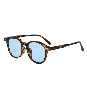 Retro tortoise shell sunglasses with light blue lenses and silver rivets in 45-degree view