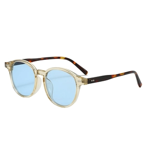 Retro sunglasses with translucent yellow frames and blue lenses at a 45-degree angle