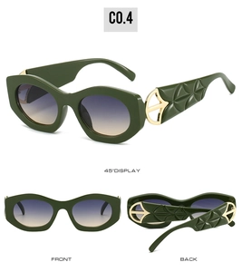 Macro view of dark green cat eye sunglasses with gold hollow hinge and leaf-patterned arms