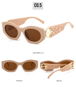 Detail view of cat eye sunglasses with beige frames and golden geometric relief temples