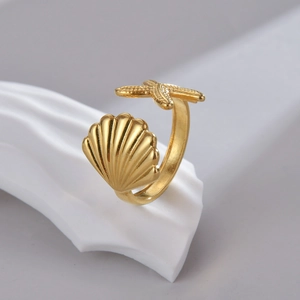 Gold starfish and shell open ring with sparkling cubic zirconia on a minimalist wave base