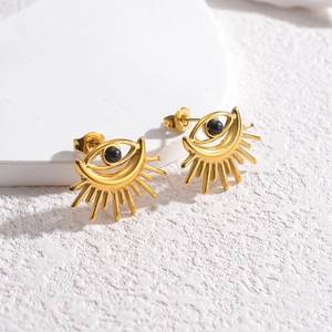 Boucles d'oreilles œil maléfique dorées avec centre noir et design solaire radiant