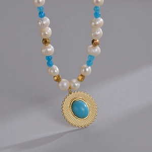 Vintage 14K gold plated necklace with pearls, blue beads and sunburst stone pendant