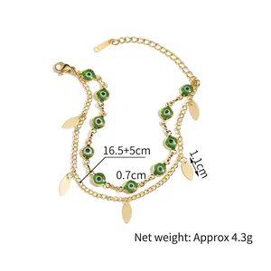 Double-layered 14K gold-plated stainless steel bracelet with green evil eye and leaf charms