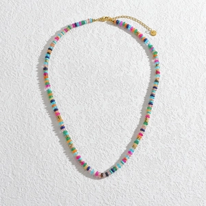 Detail view of colorful bohemian beaded necklace with 14K gold plated accents and clasp