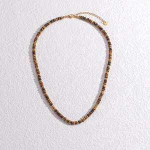 Detail of tiger eye beaded necklace with gold spacers and adjustable lobster clasp