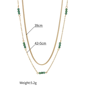 Double-layered stainless steel necklace featuring emerald green beads and gold box chain