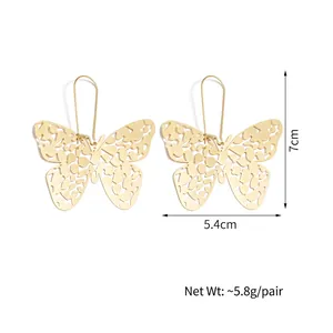 Golden hollow butterfly drop earrings with long hooks and detailed laser-cut texture