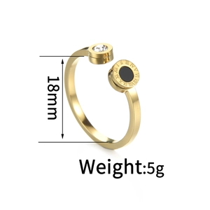 Detail of gold-plated stainless steel open ring with Roman numerals and crystal inlay