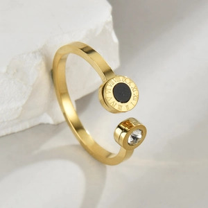 Gold stainless steel open ring with Roman numerals and sparkling cubic zirconia accent