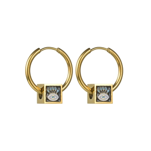 Detailed macro of gold square cube earrings with blue enamel evil eye charm on hoop