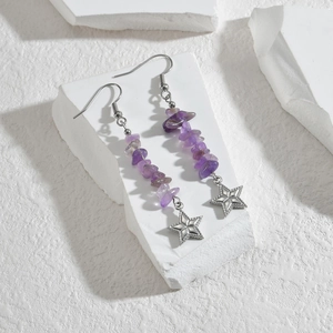 Detail of purple crushed stone drop earrings with silver metal star pendants