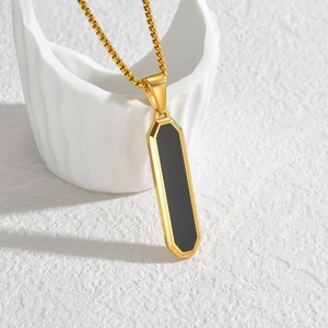 Minimalist gold geometric pendant necklace with black rectangular inlay on beaded chain