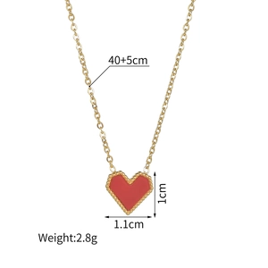 Gold stainless steel necklace with a red heart pendant and beaded border details