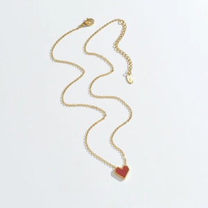 Elegant gold-plated stainless steel necklace featuring a bold red heart pendant with bead edge