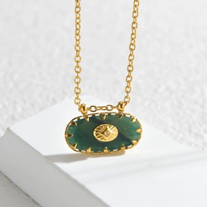 Oval green zircon star pendant necklace in gold plated stainless steel on white stone