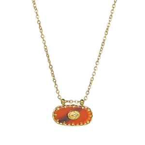 Vintage oval gold necklace with carnelian pendant and zircon eye detail on white background