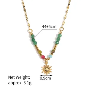 French sun pendant necklace with colorful beads and gold plated chain on white background