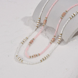 Minimalist 14K gold plated stainless steel beaded necklace with white and pink beads