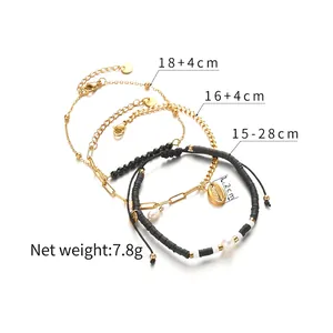 Set of four 14K gold plated stainless steel bracelets with black beads and pearl shell charm