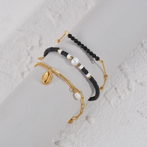 Three-piece 14K gold plated bohemian stackable bracelet set with clay beads and pearl charms