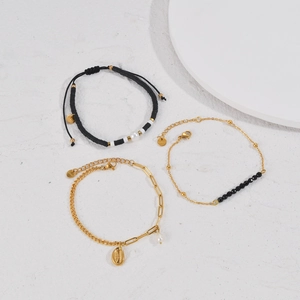 Three-piece set of 14K gold plated stainless steel bracelets with pearls and shell charm