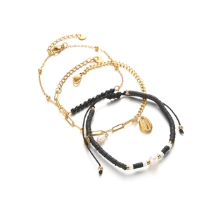 Four-piece 14K gold stainless steel bracelet set with pearls, shells, and black beads