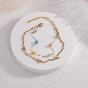 Double-layered gold stainless steel bracelet with dragonfly charm and colorful beads