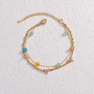 Double-layered gold stainless steel bracelet with colorful beads and dragonfly pendant