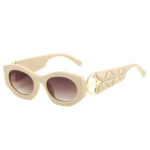 Chic cat eye sunglasses with cream frames, brown gradient lenses, and embossed temples