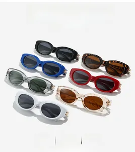 Detailed row of vintage oval cat eye sunglasses in seven colors with gold hinge accents