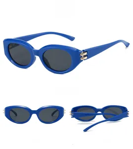 Three views of royal blue cat-eye sunglasses with golden double ring hinge details