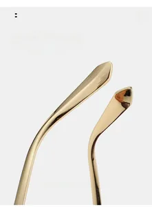 Close-up of curved golden metal temple tips with a polished mirror finish for comfort