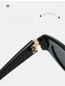 Detail of durable gold metal hinge on black cat-eye sunglasses with minimalist design