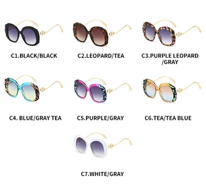 Multi-color display of oval sunglasses with wavy gold metal temples in seven stylish options