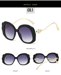 Detailed views of oval sunglasses with wavy black frames and golden heart-shaped temples